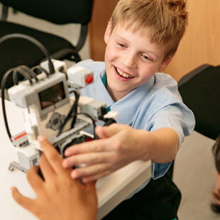 A student using robotic technology in class