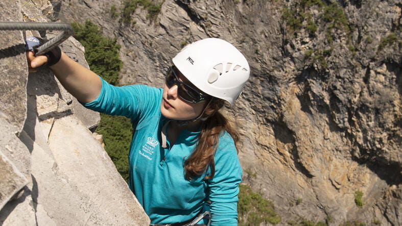 A student rock climbing