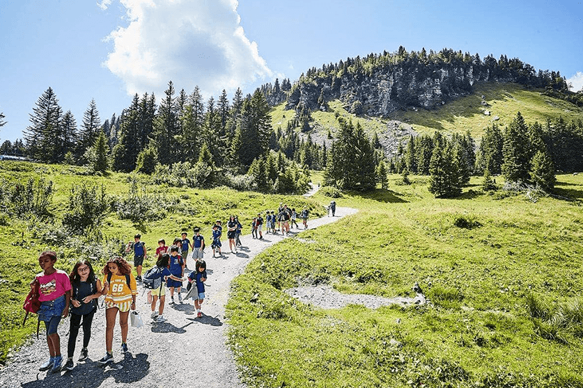 Children walking in alpine setting