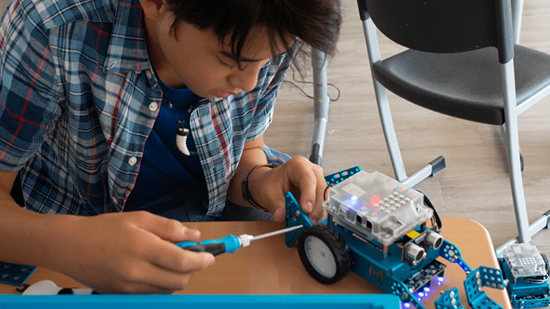 Student building a robot 