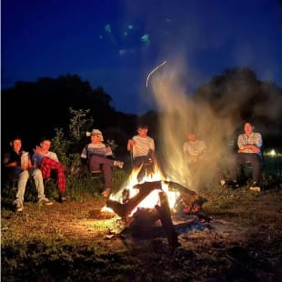 tanzania expedition nord anglia students by campfire