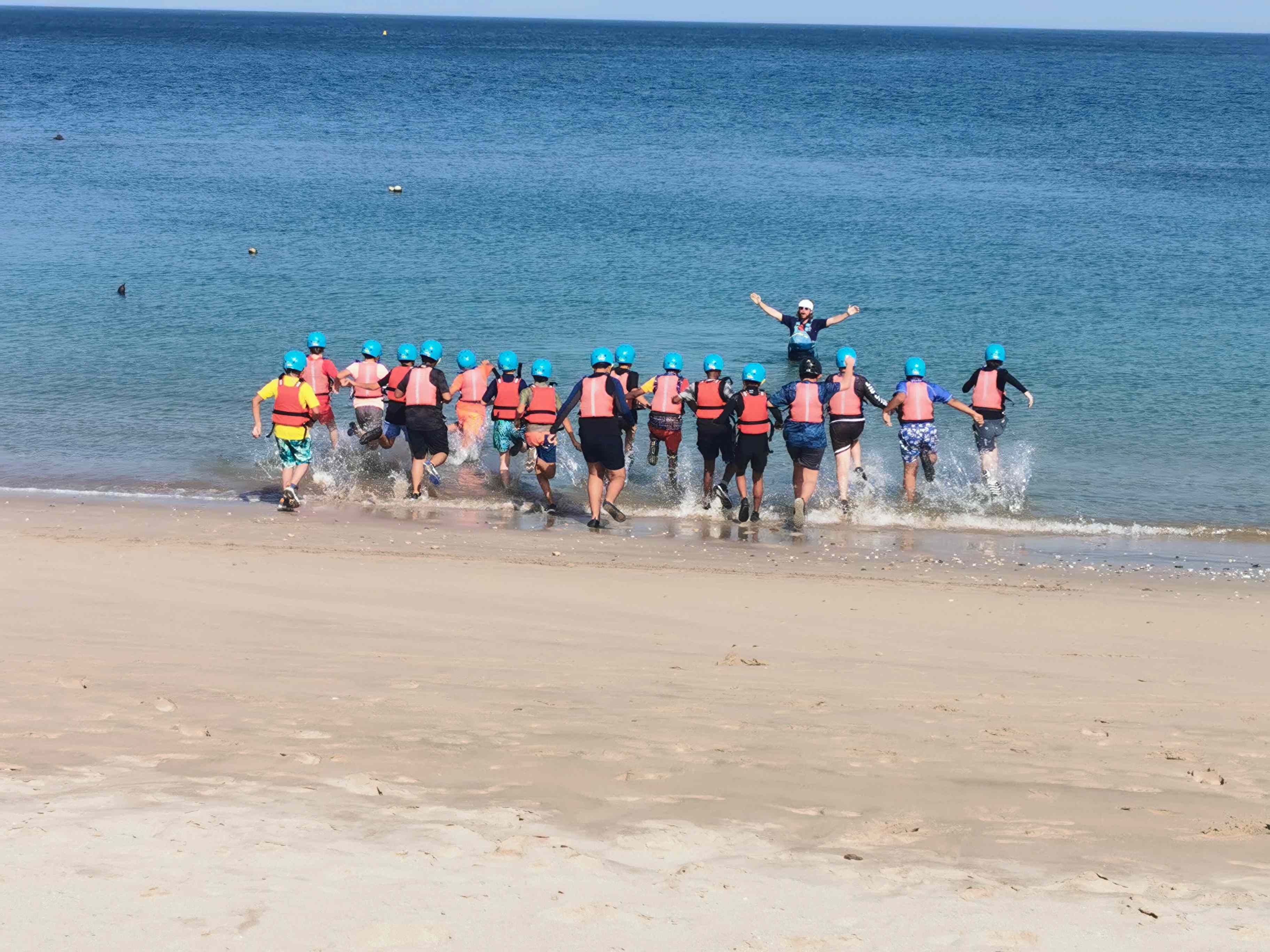 Students on beach in Dibba