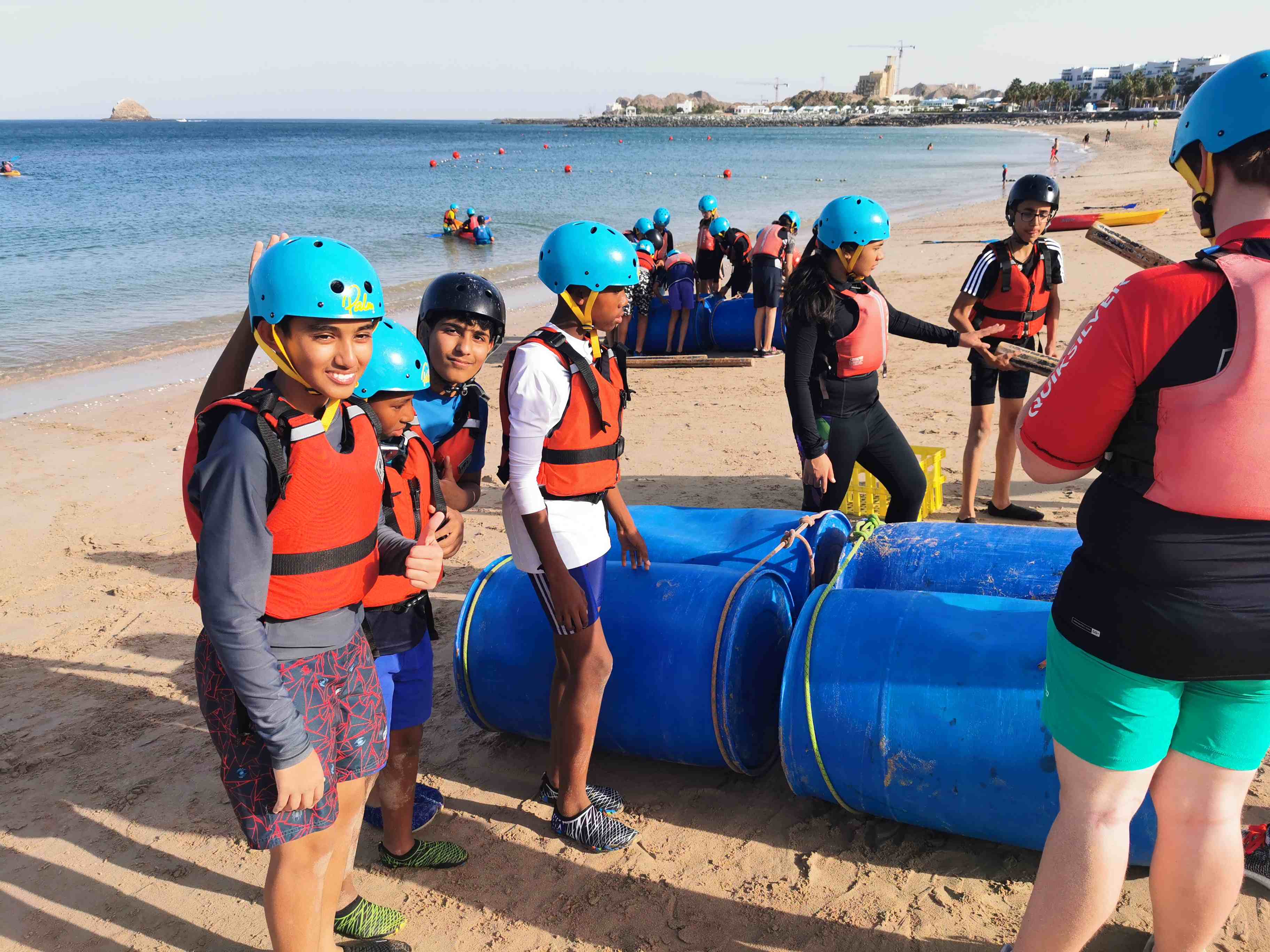 Students building a raft in Dibba