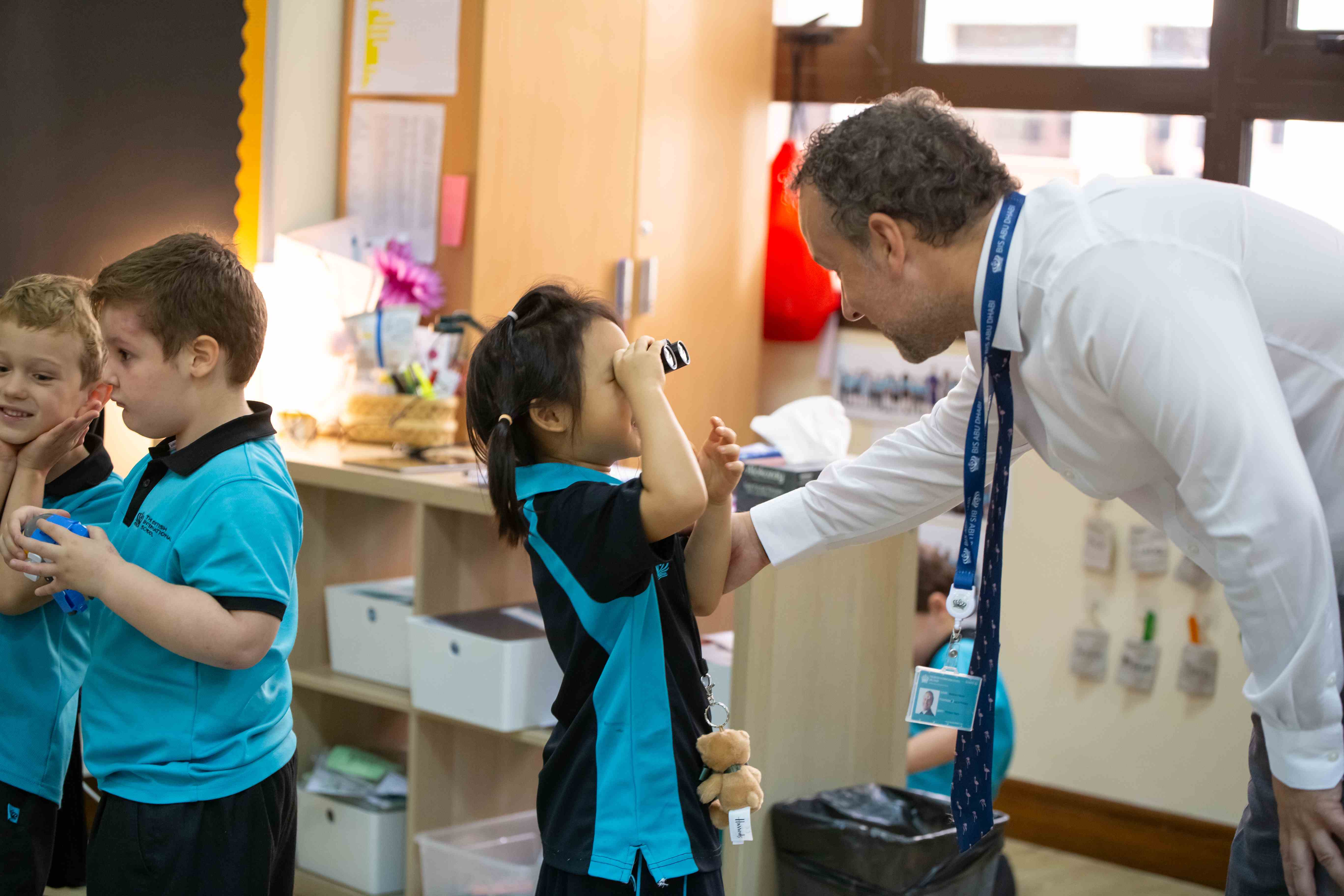 Matthew Harper, Deputy Head of Primary, playing with student