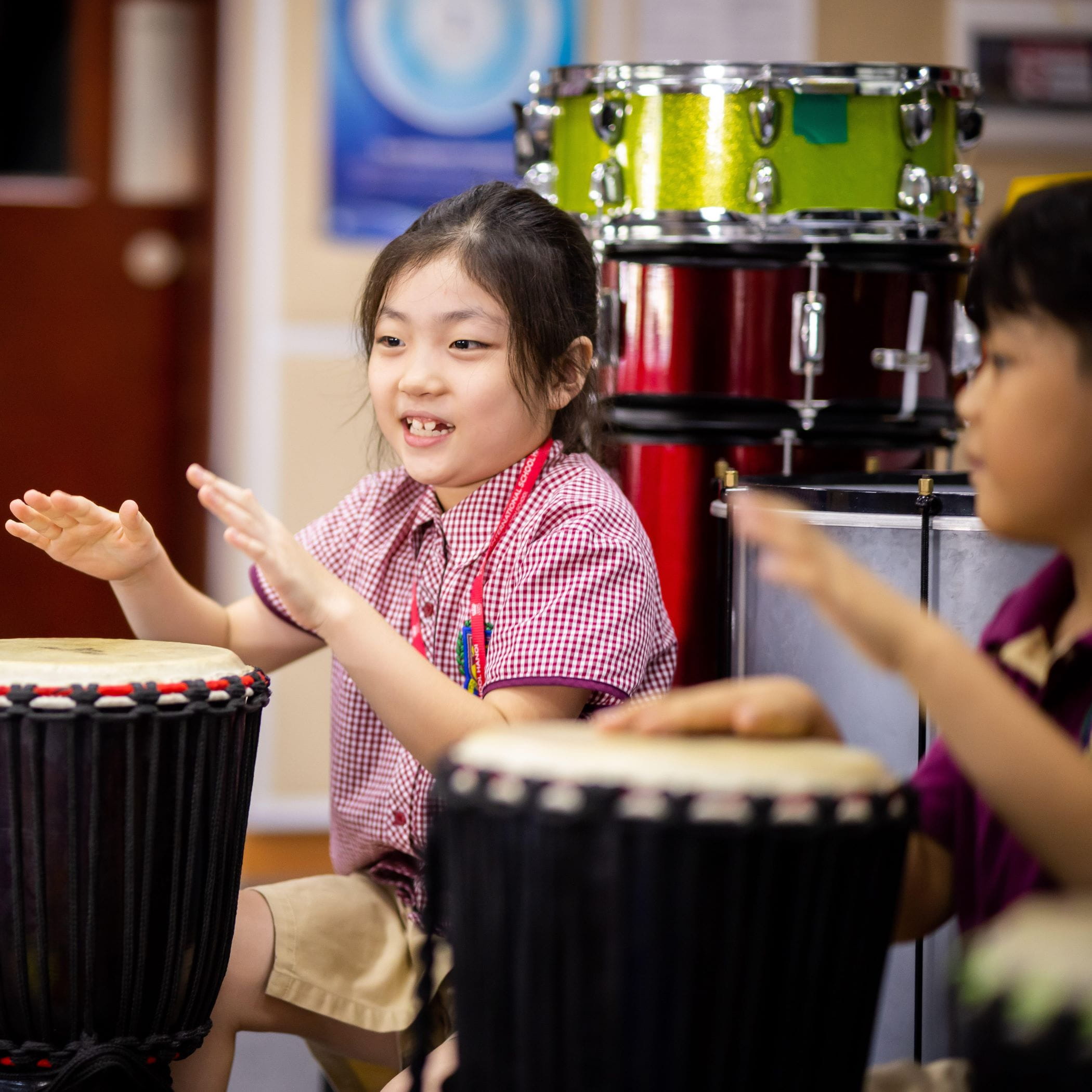 Primary students playing drums