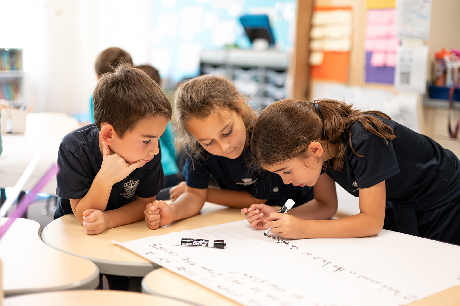 Students writing cursive