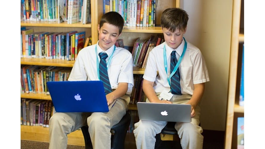 MS boys on computers in library