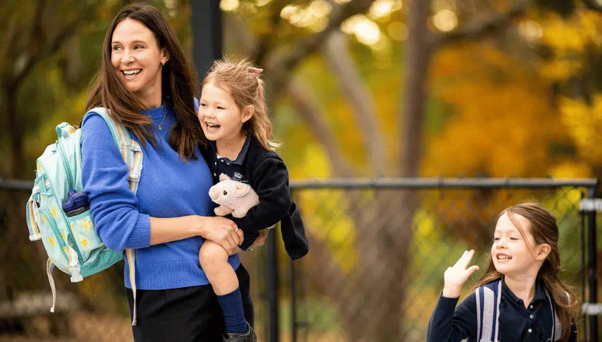 Parent holding BISB student