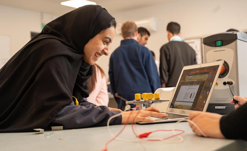 Al Khor student working in a class