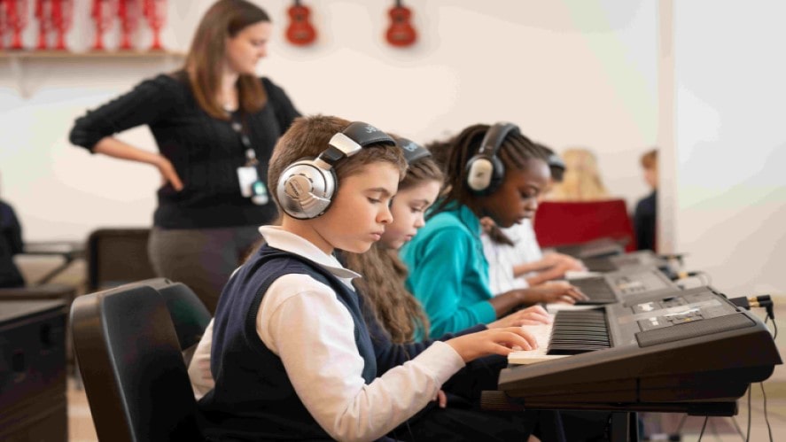 Young boy playing the keyboard