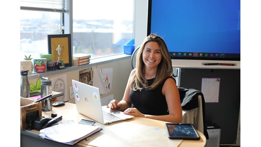 Lowri C at her desk