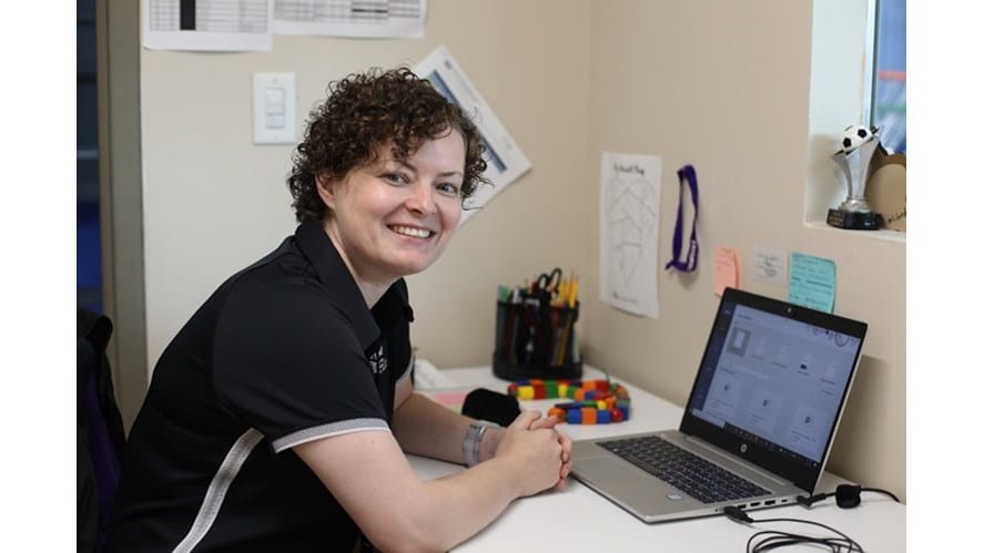 Caroline G at desk