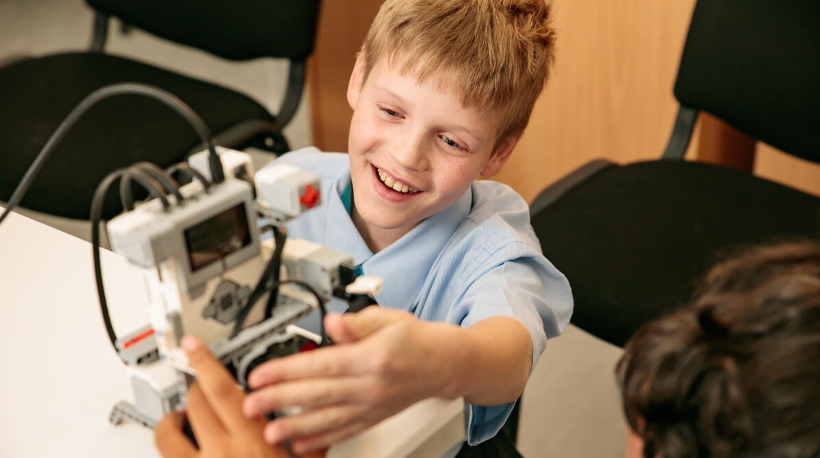 Students working together to program a robot