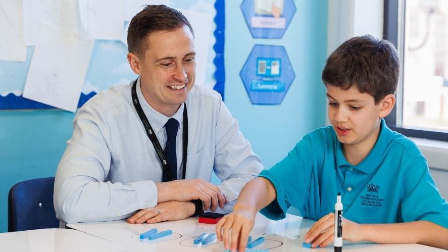 Teacher with student