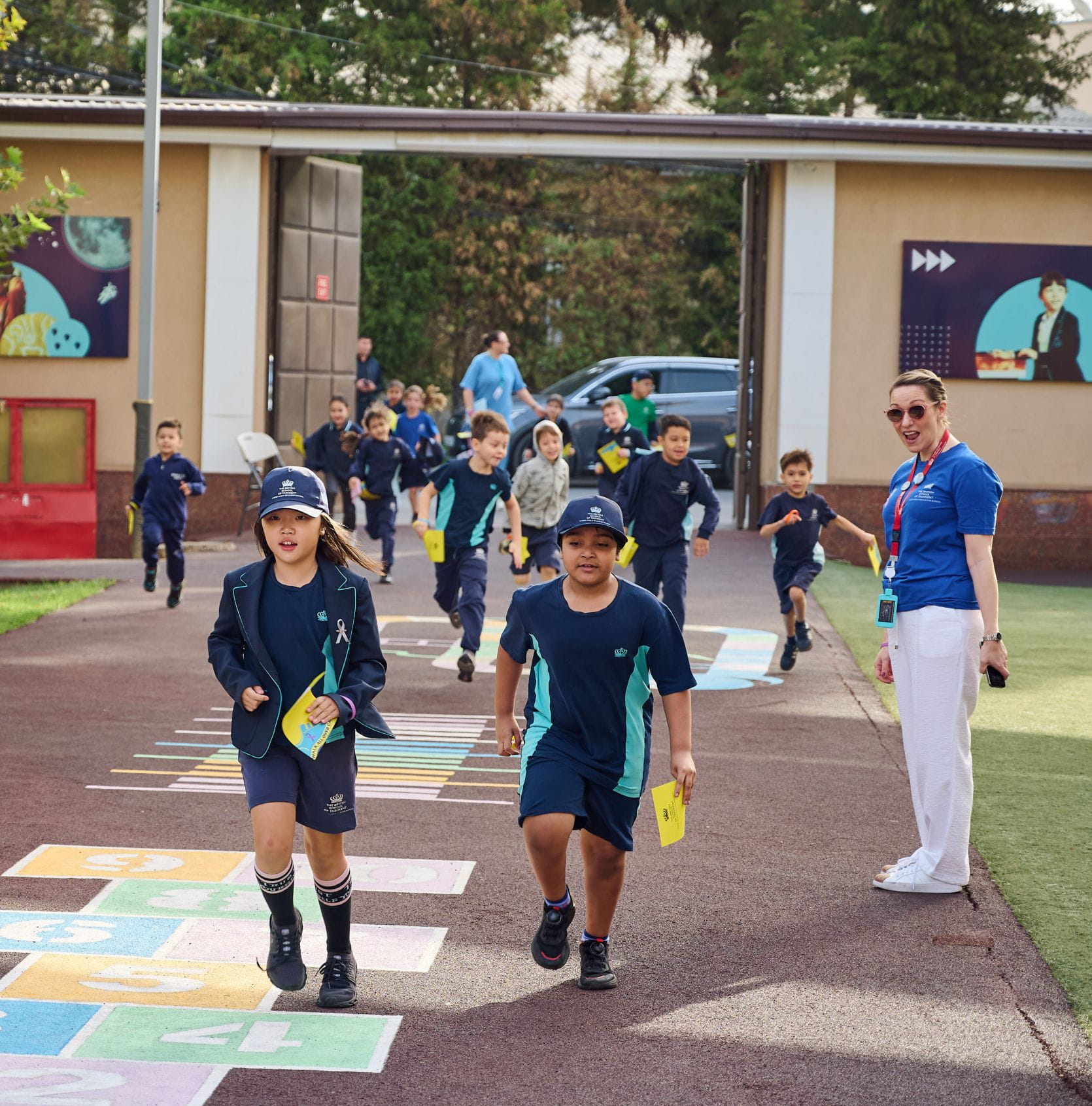 Students, staff, and parents of The British School of Tashkent walking together for the 2025 Walk All Over Cancer fundraiser.
