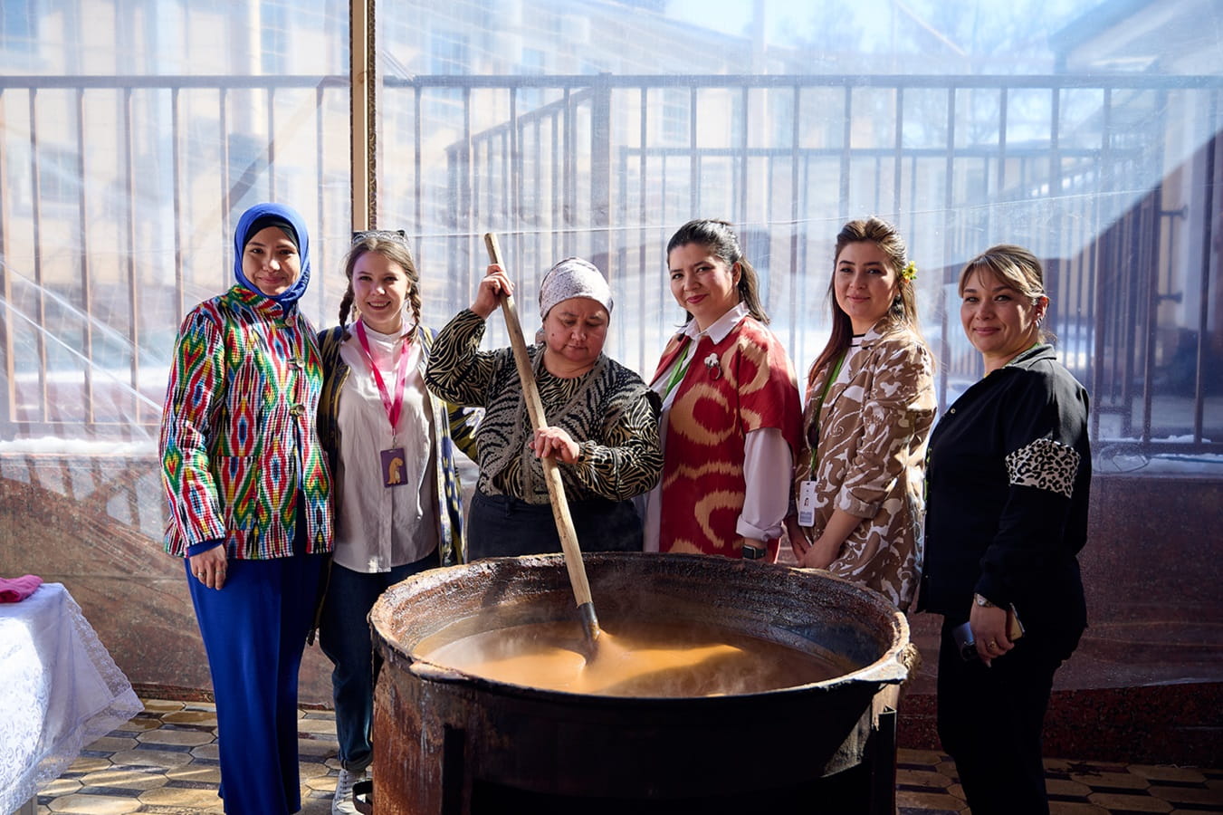 Uzbek women stirring sumalak