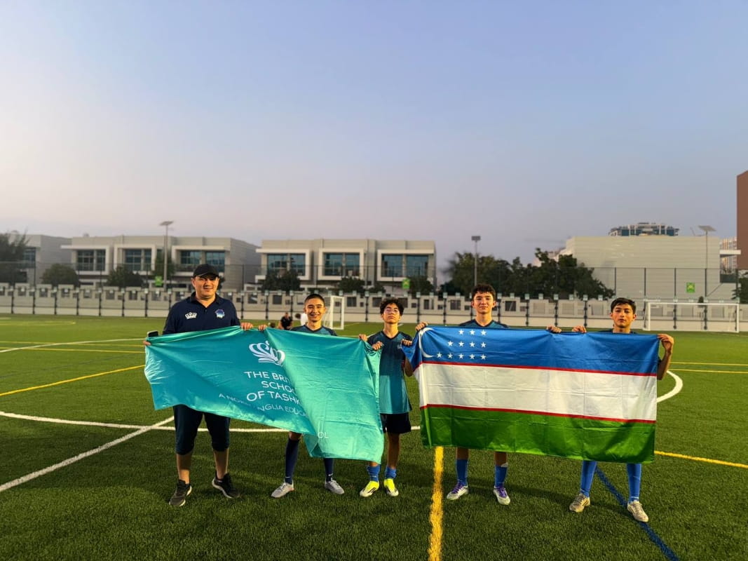 BST students and teachers posing together in Abu Dhabi during a football tour and cultural visit