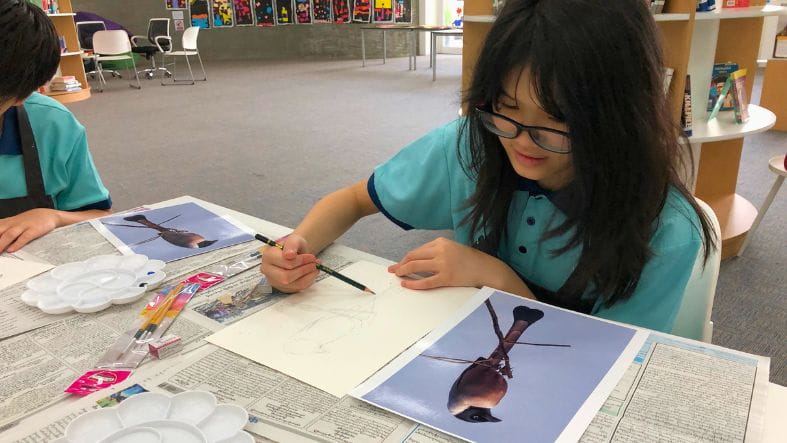 Year 6 Student on a drawing of a threatened bird species of Myanmar