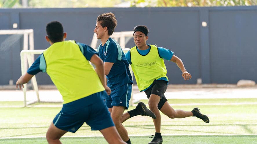 Boys running for the ball