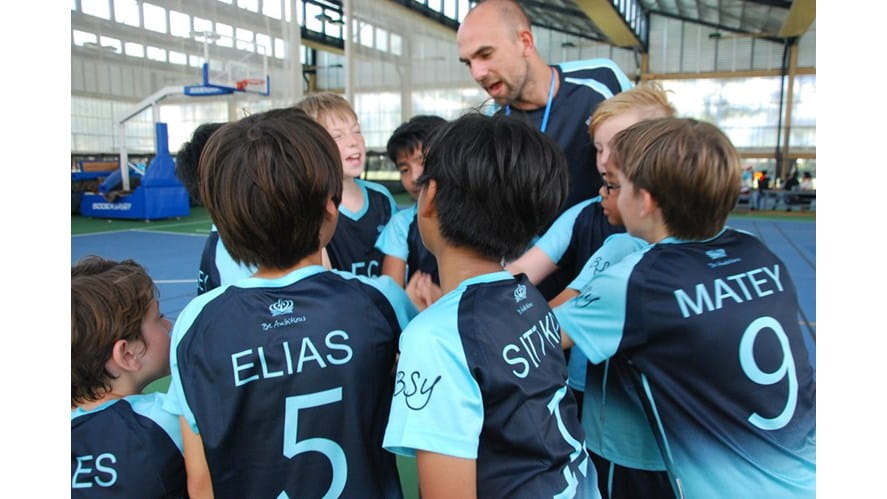 Team huddling before start of football match