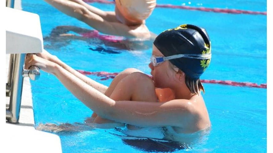 boy about the starting swimming in a race