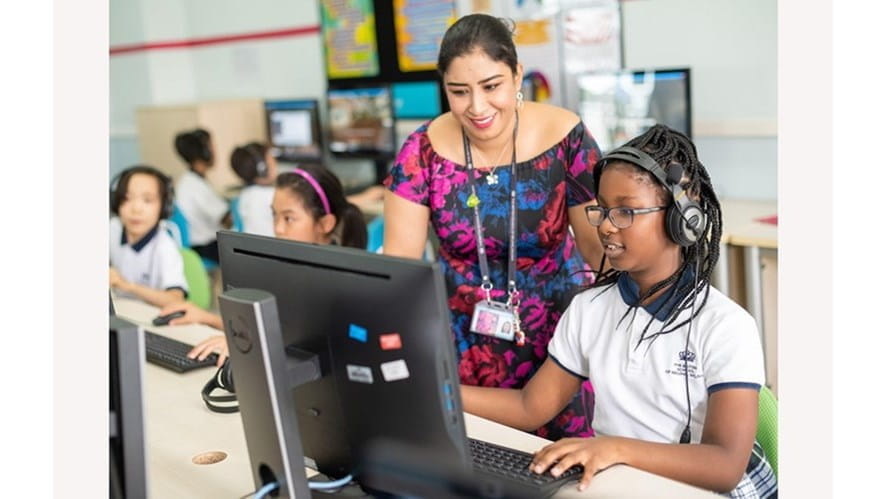 Teacher helping student