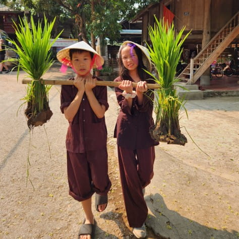 Children holding wood
