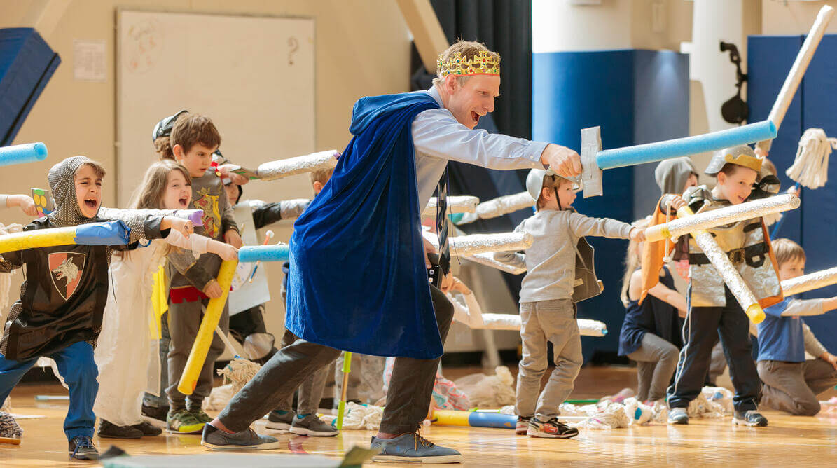 Teacher leading a drama class