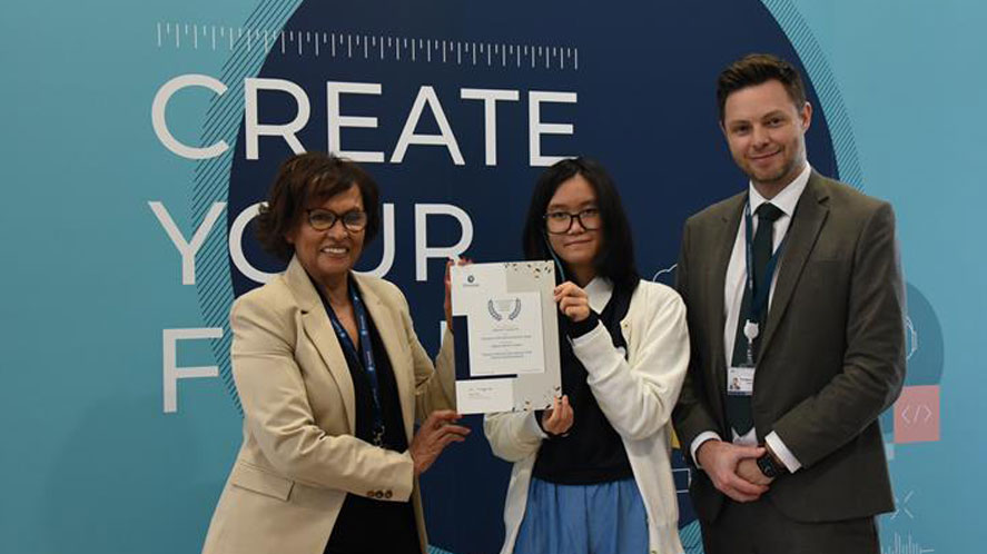 Student receiving Pearson Award at Compass International School