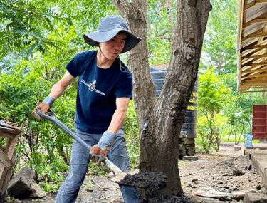 Boarding student participating in a service project abroad, developing responsibility and leadership through global citizenship.