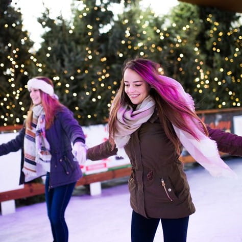 girl ice skating with friends