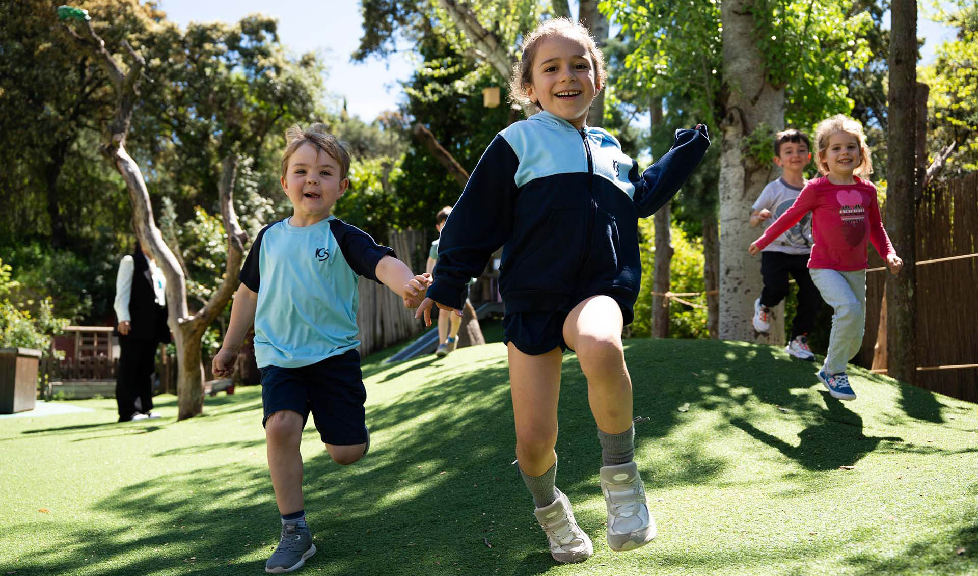 Children playing in a garden in kindergarten at ICS Madrid