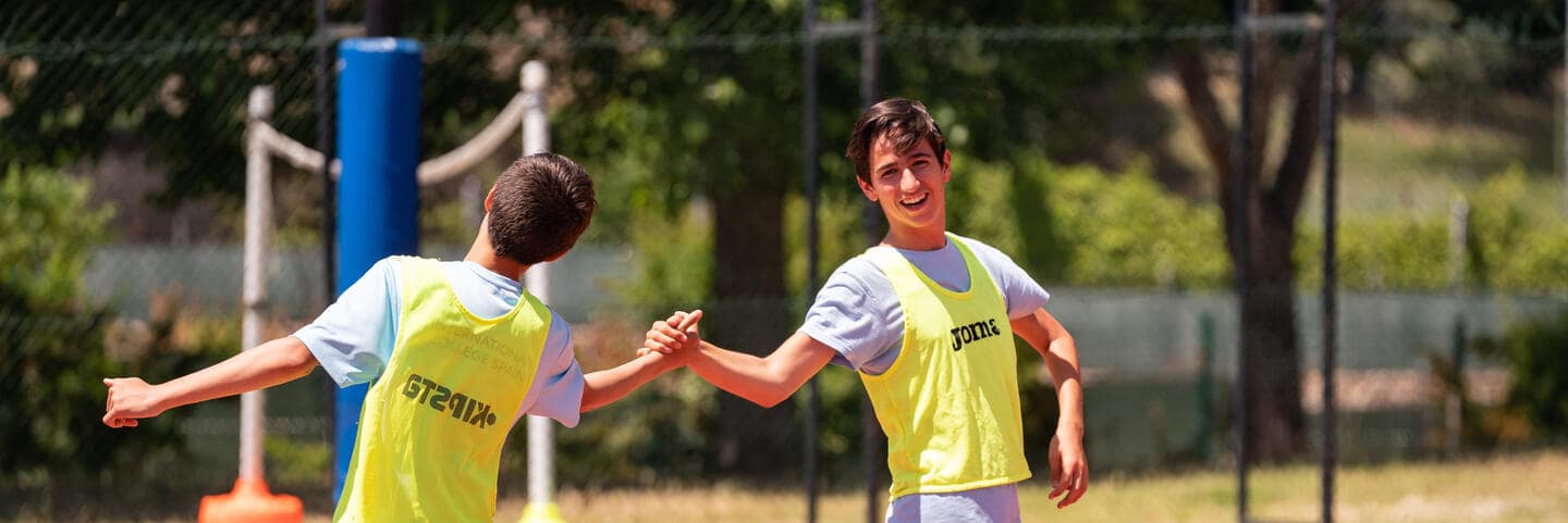 Two boys shaking hands