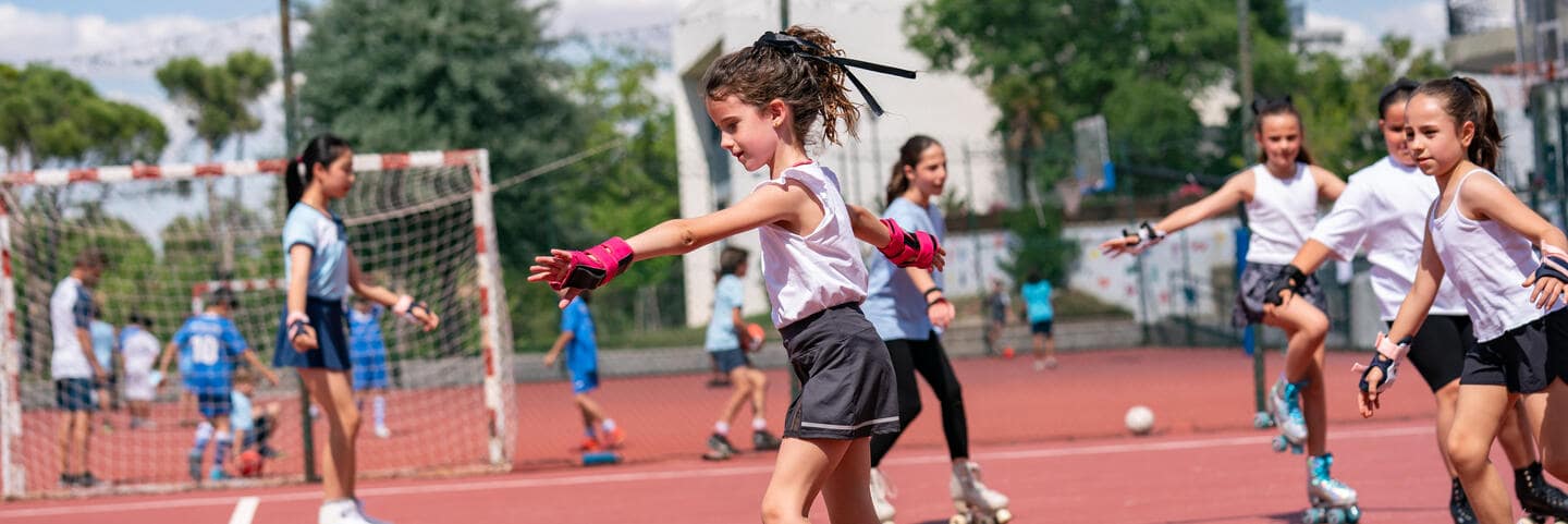 Girls skating in playground