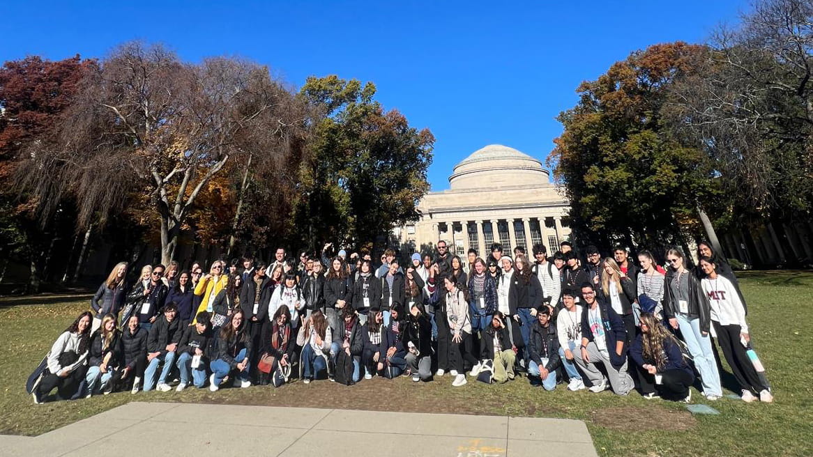 A group of around 60 students of Nord Anglia smiling in their MIT experience