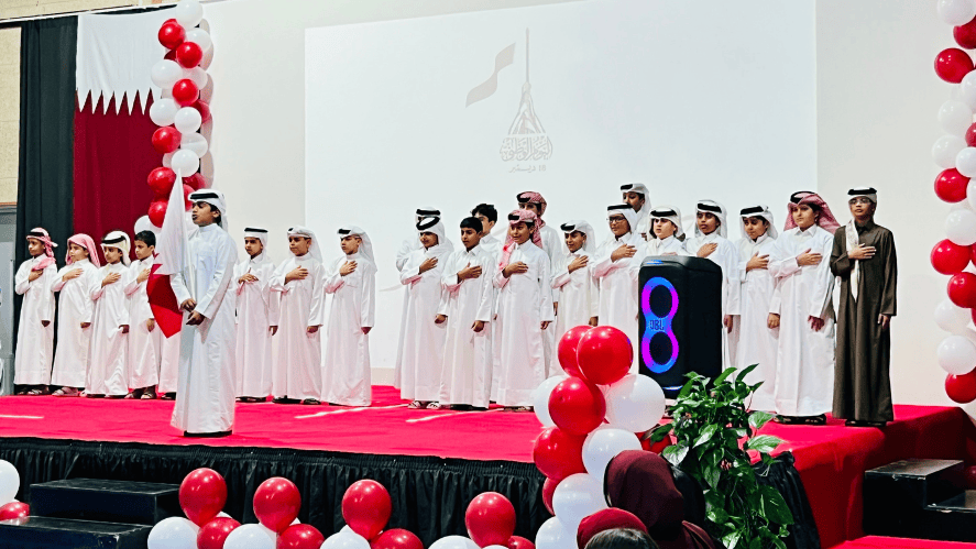 NAISAK celebrated Qatar National Day 2025 in Al Khor with cultural performances, student booths, traditional food, and strong community spirit—rain or shine.