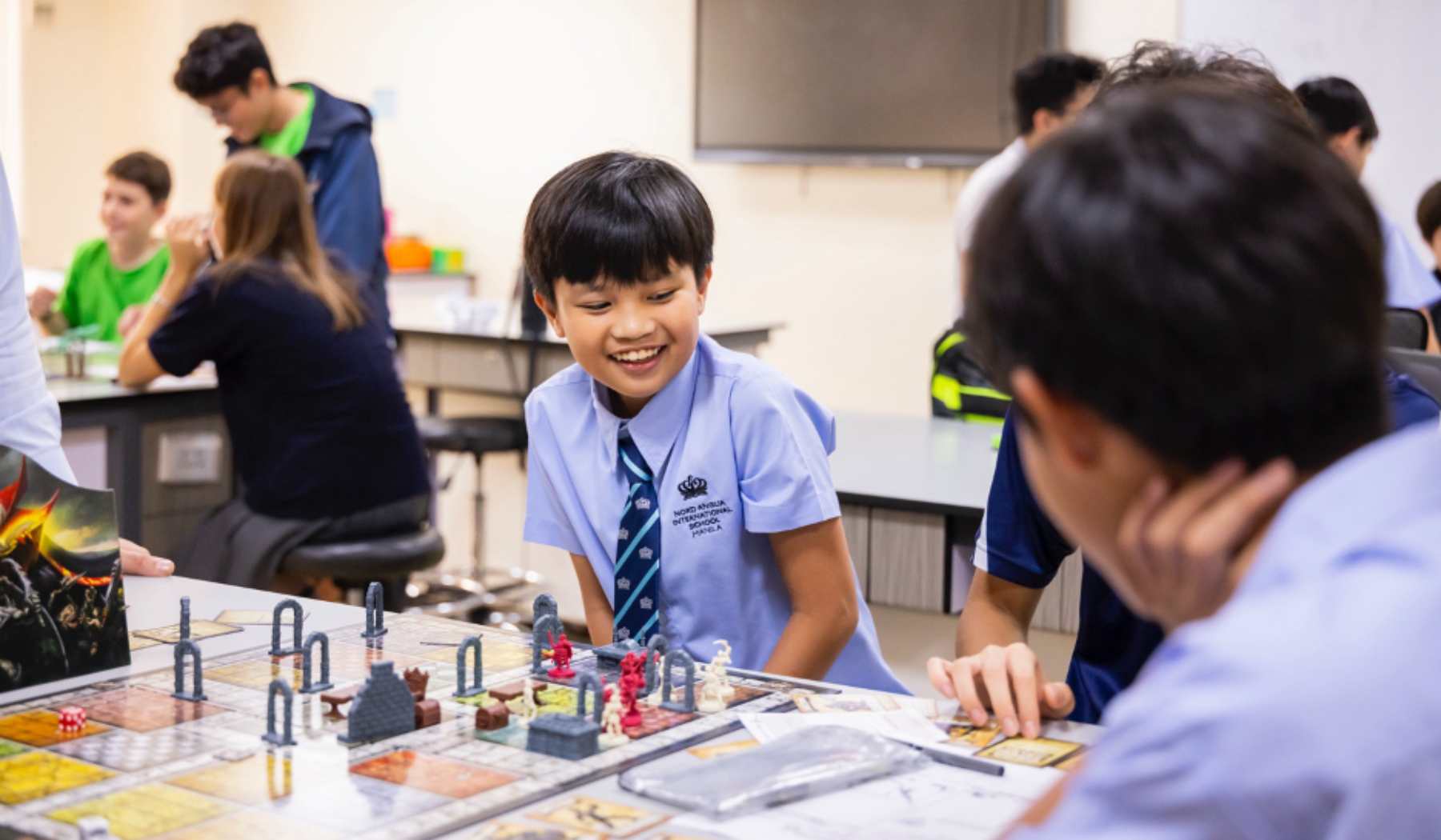 male student playing board games