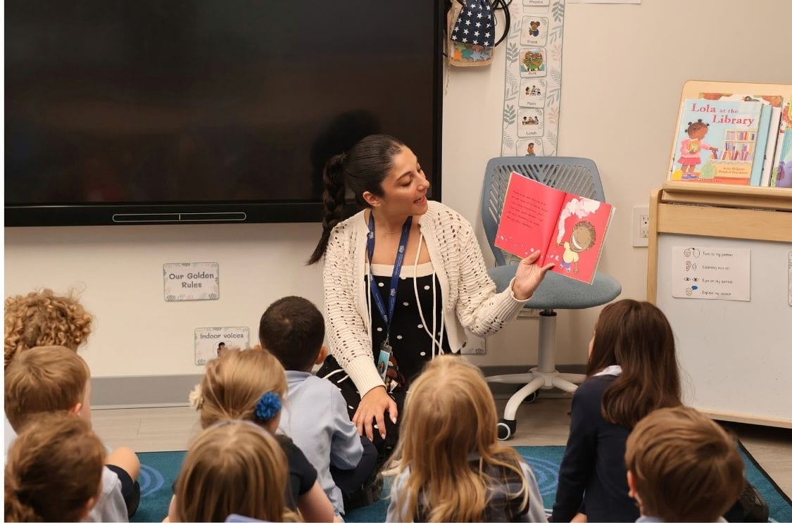 Pre-K teacher reading to students