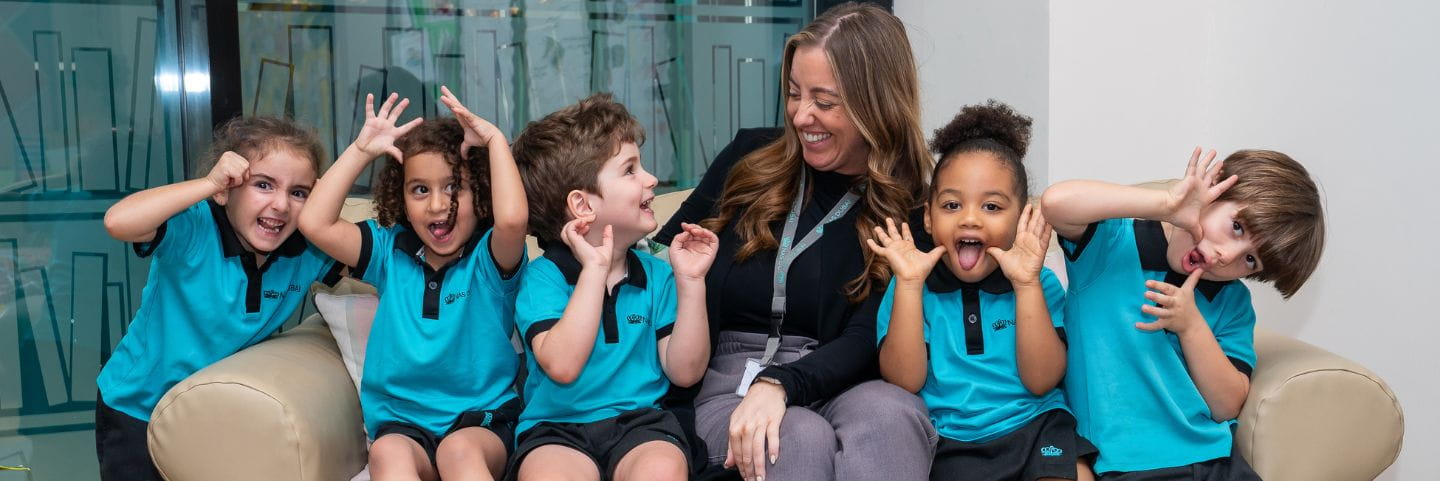 deputy head of primary with students at nas dubai 