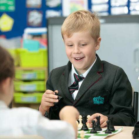 Two young childen playing chess - Key Stage 1
