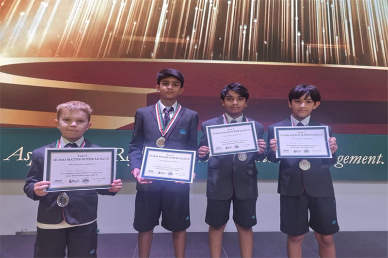 NAS Dubai Y5 Maths Super League team holding their certificates 