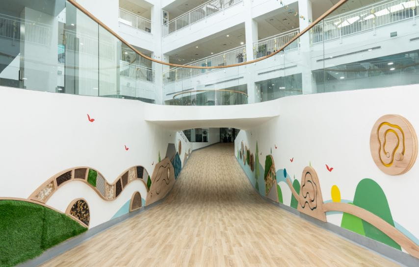 EYFS sensory walkway at NAS Dubai featuring interactive wall elements designed for early years learning and development.