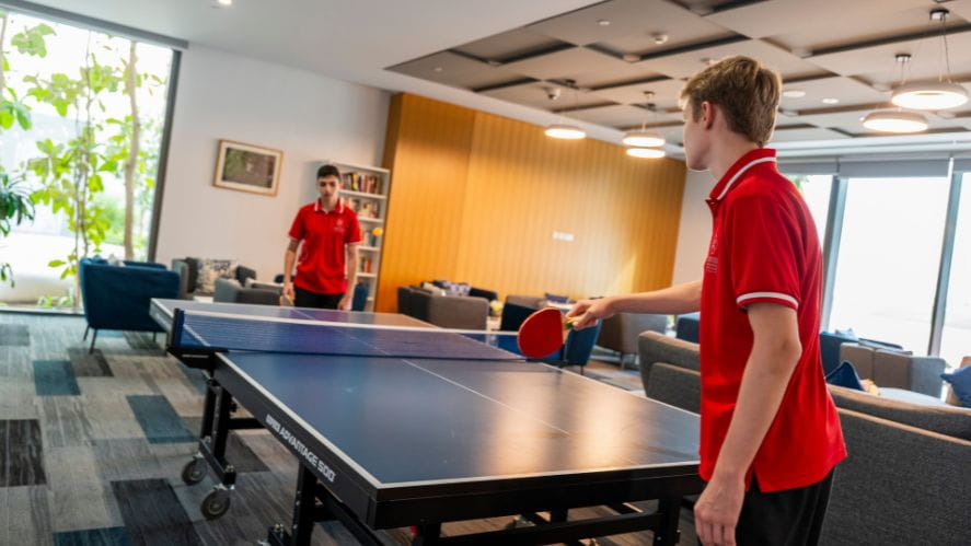 Students playing table tennis