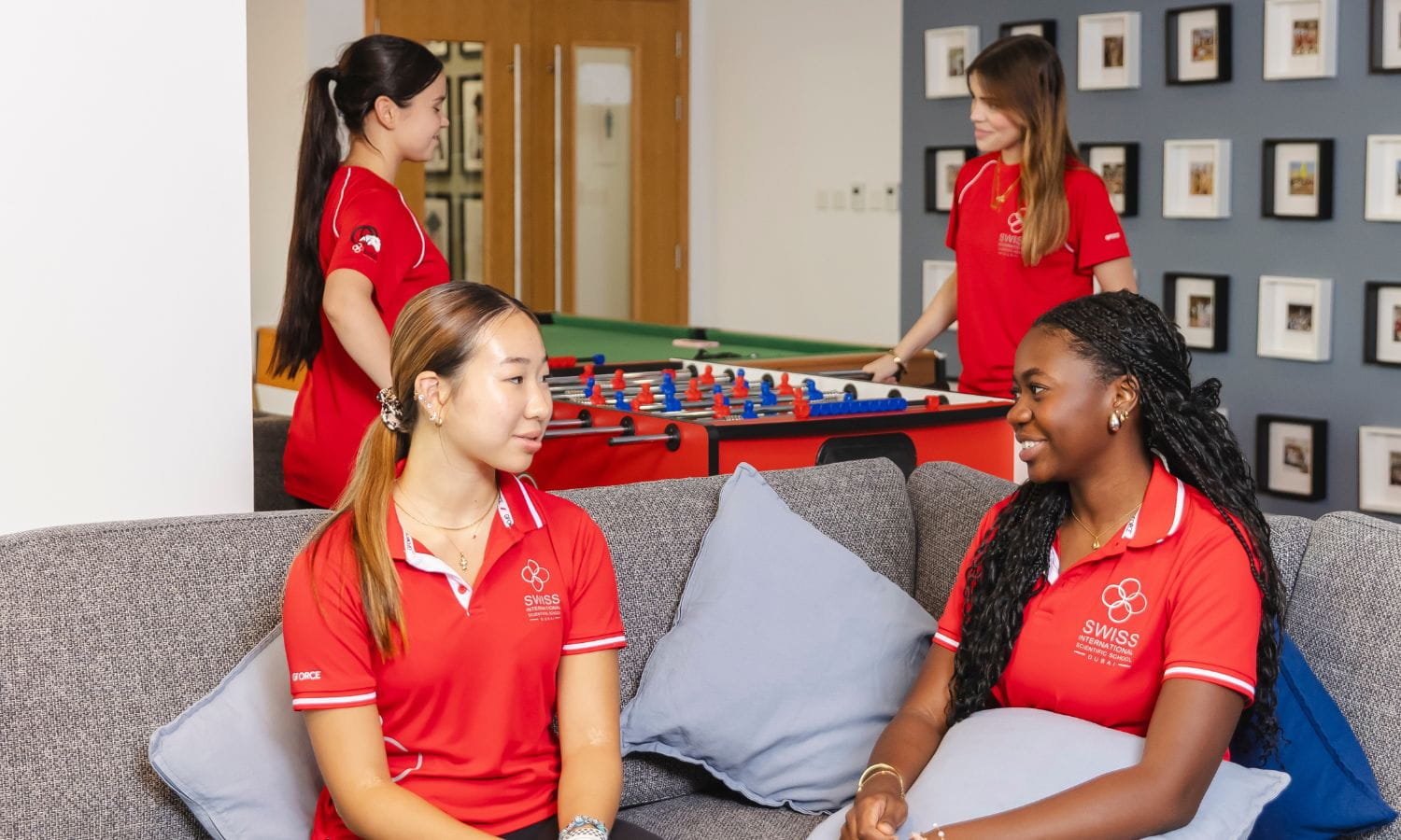boarding students sat on a sofa