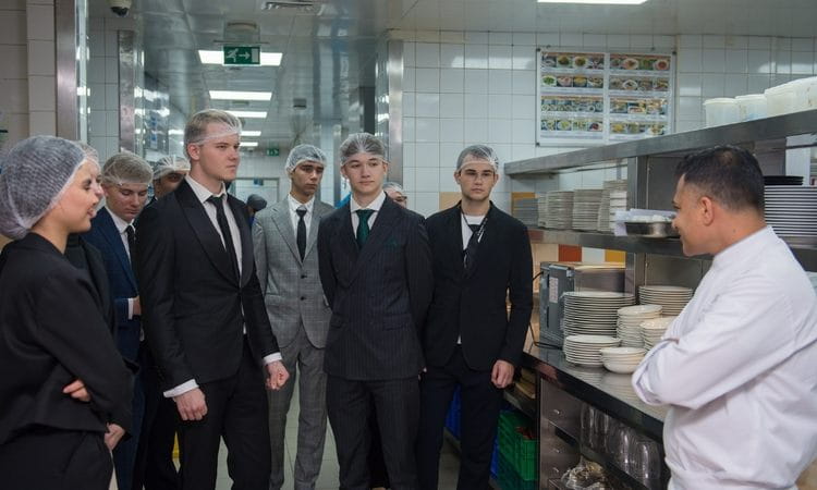 Students in the kitchen in a hotel