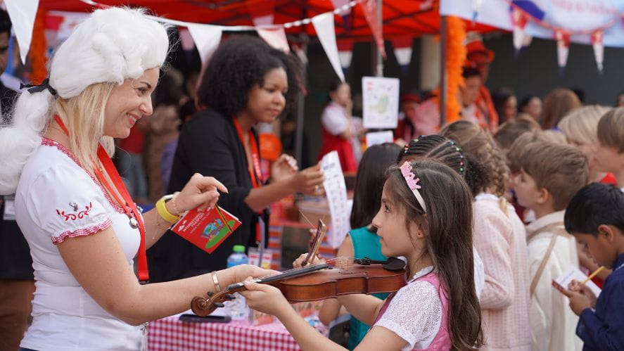 Parent handing items out an school event