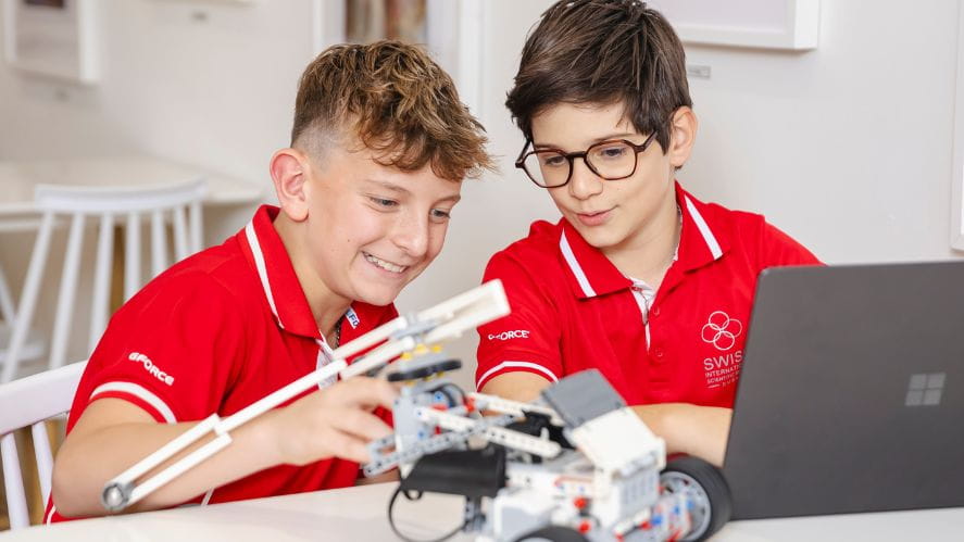 Boys working with robotics