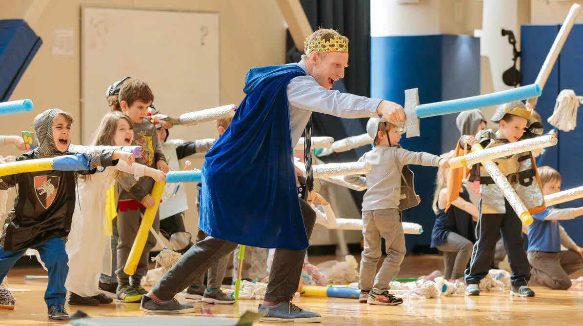 Teacher leading a drama class