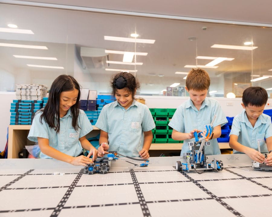 Student playing with robots