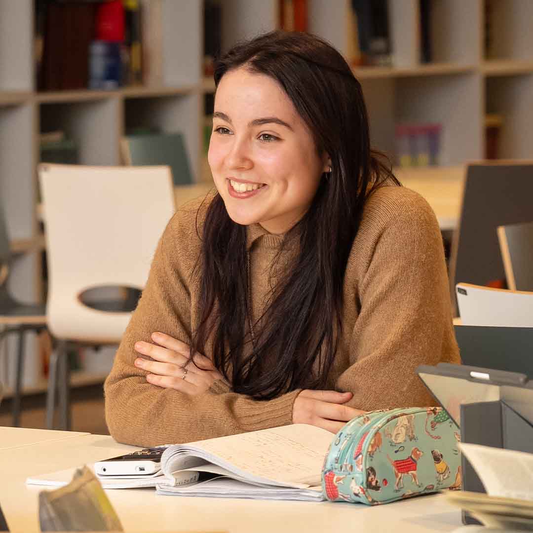 smiling girl with a notebook